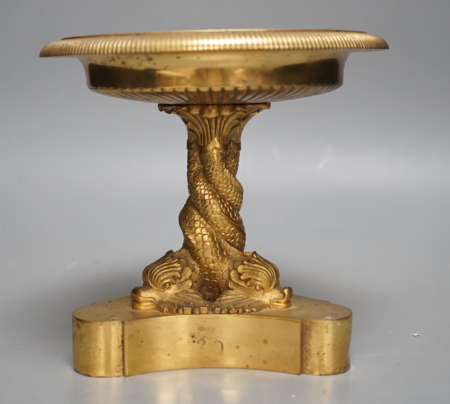 A Regency ormolu pedestal bowl, with dolphin stem, diameter 19cm, height 18cm.